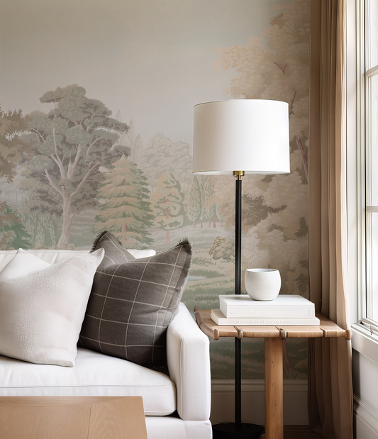 Living room with a white sofa, lamp, and side table against a wall with nature-themed wallpaper.