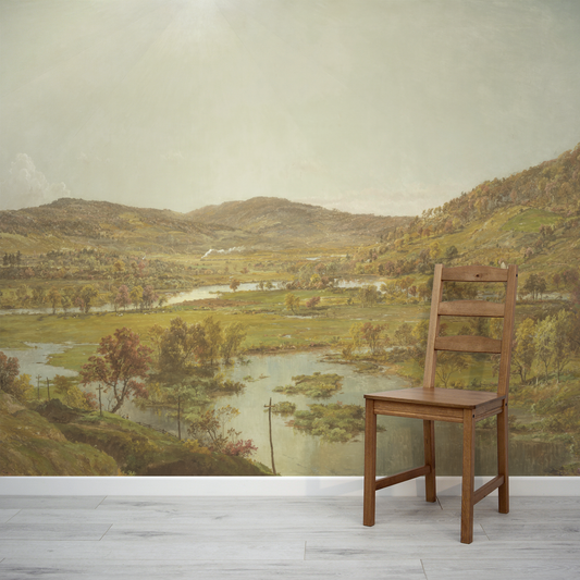 Wooden chair in front of a scenic landscape wall mural.