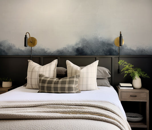 Modern bedroom with a bed, pillows, and wall art.