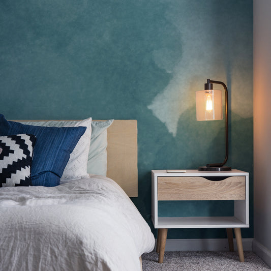 Onimbus Moody Teal Watercolour Cloud Wallpaper in a cosy bedroom