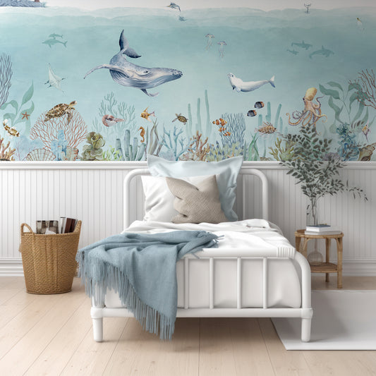 Secret Sealife Wallpaper In Room With White Wood Panelling And Small Single Bed With Blue Cushions