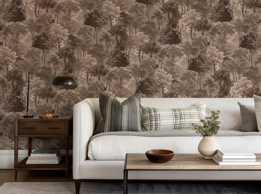 Living room with a forest-themed wallpaper, white sofa, and decorative items.