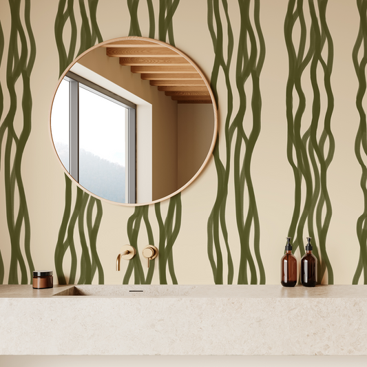 Bathroom with green wavy patterned wallpaper, round mirrors, and bathroom accessories.
