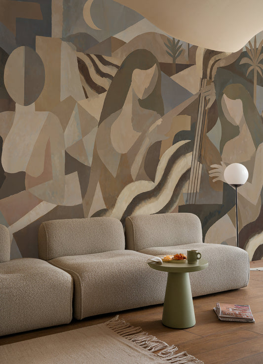 Modern living room with abstract wall art and a beige sofa.