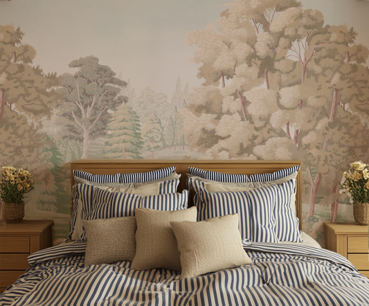 Bedroom with striped bedding and pillows against a forest mural wall.