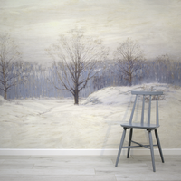 Gray stool in front of a wall with a winter landscape mural