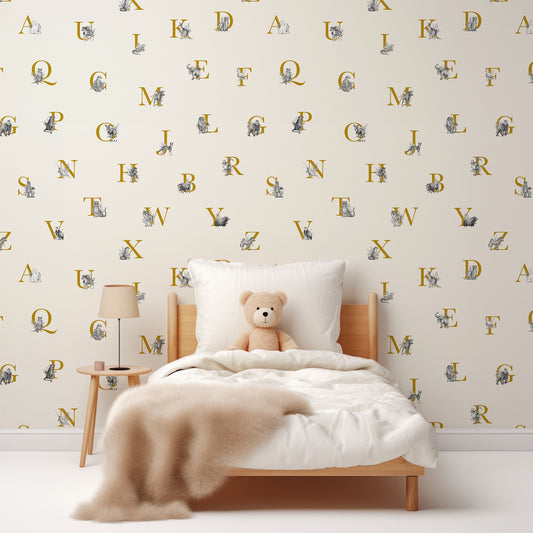 Animal Alphabet Gold Wallpaper In Children's Bedroom With White Bed And Fluffy Beige Blanket With Teddy Bear In The Bed