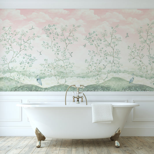 Bathroom with a freestanding bathtub against a scenic wall mural