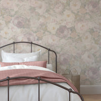 Bedroom with floral wallpaper and a bed with pink and white bedding.