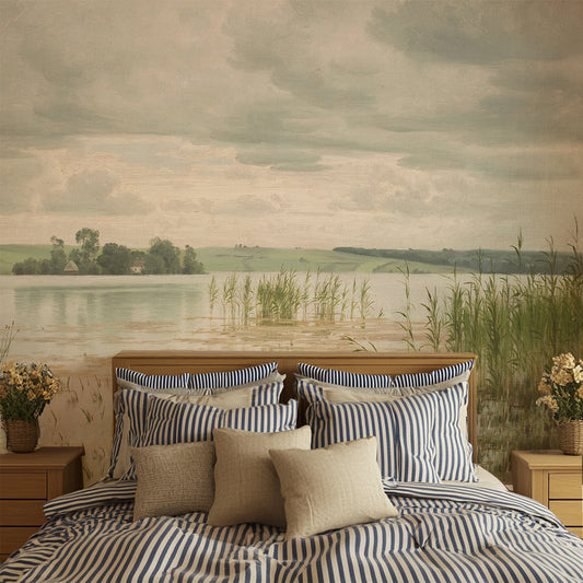 Beverley Wallpaper in a Bedroom with striped bedding and pillows, featuring a mural of a landscape.