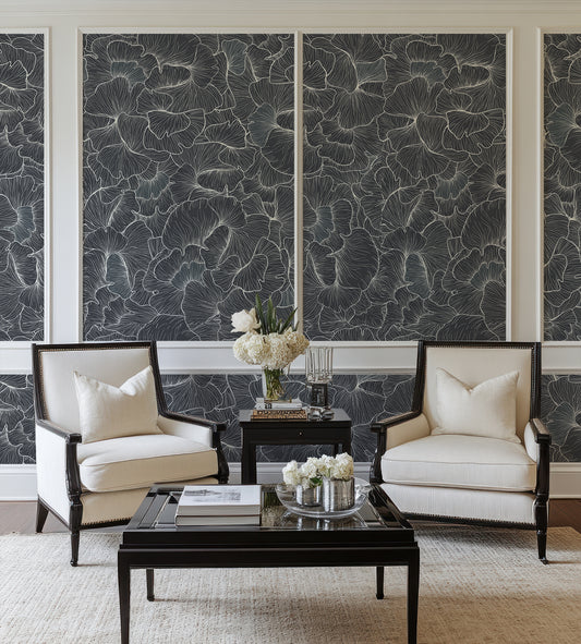 Chanterelle Wallpaper in a Living room with two armchairs, a coffee table, and decorative elements against a detailed navy floral wall.