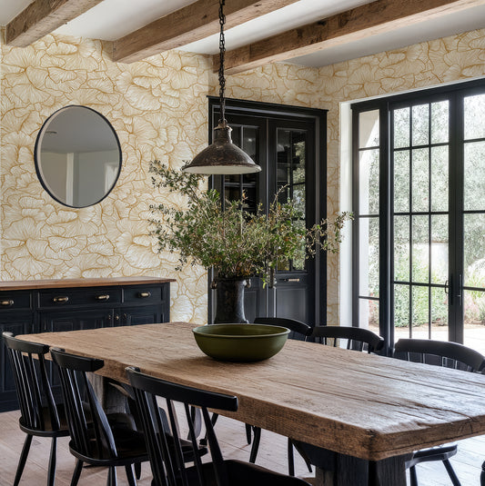 Chanterelle Gold Wallpaper in a Dining room with wooden table, black chairs, and floral wall