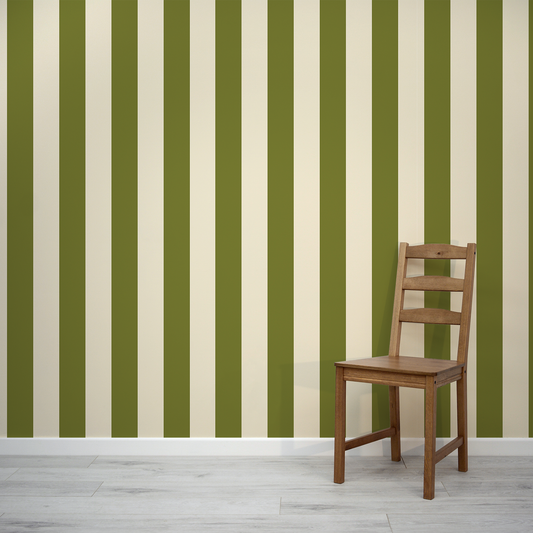 Wooden chair against a green and white striped wall.