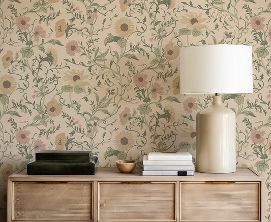 Decorative wall with the Clytie floral pattern, wooden sideboard with lamp and books, and decorative bowl.
