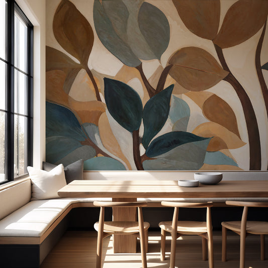 Dining area with a large leaf-patterned wall mural and wooden table.