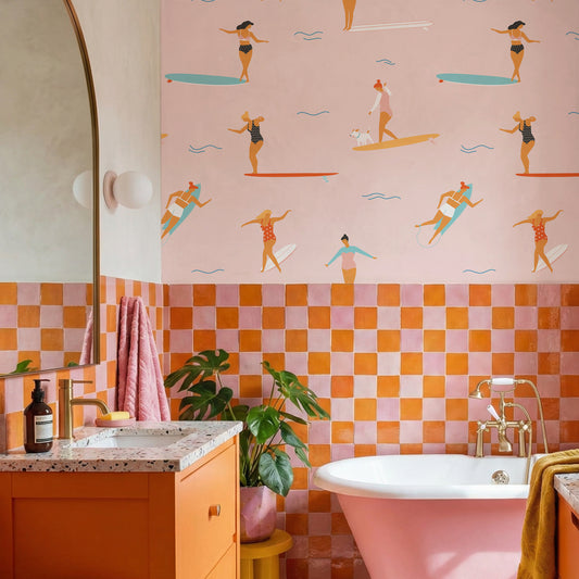 Germane in colourful bathroom with pink and orange half-tiled wall