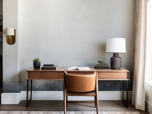Modern home office with wooden desk, chair, and decor elements.
