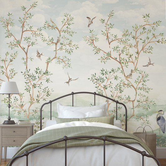 Bedroom with decorative wall mural featuring trees and birds