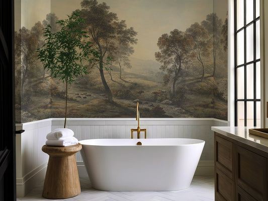 Bathroom with freestanding bathtub, wooden stool, and wall mural of a landscape.