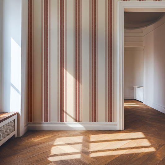 Room with striped wallpaper and sunlight casting shadows on the floor