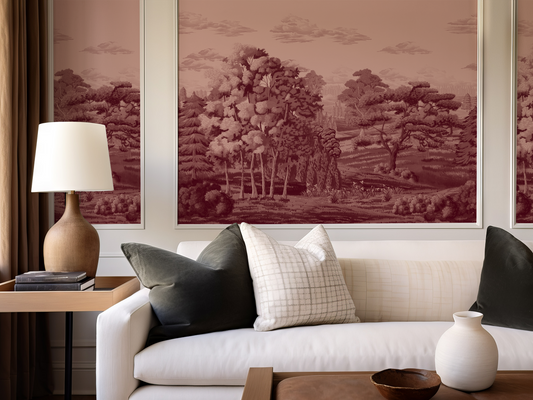 Living room with a beige sofa, decorative pillows, and wall art depicting landscapes.