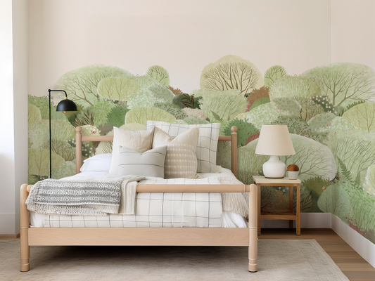 Soft watercolour forest mural in a neutral bedroom with white covers and a bedside table with a white lamp