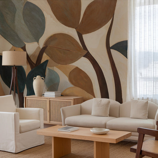 Living room with beige sofa, armchair, and coffee table against a leaf-patterned wall.