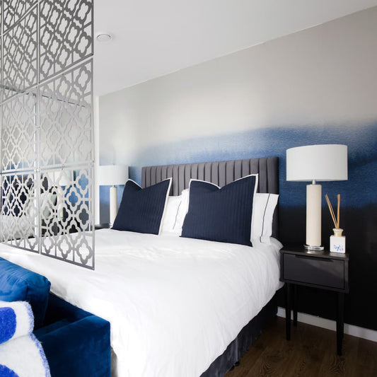 'Cerulean' Blue watercolour gradient wallpaper mural in a stylish modern bedroom.