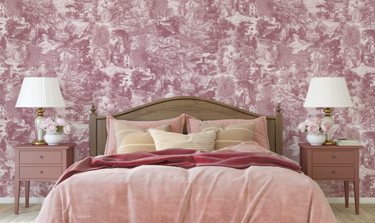 Bedroom with pink toile wallpaper, wooden bed, and matching nightstands.