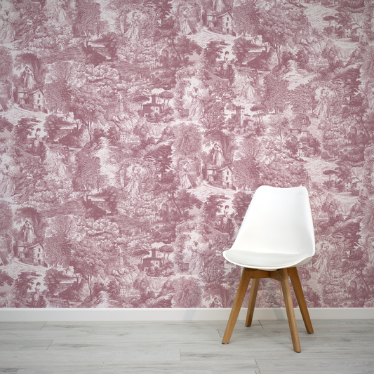 White chair in front of a wall with toile patterned wallpaper