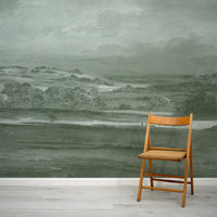 Vintage watercolour landscape painting mural with a wicker chair