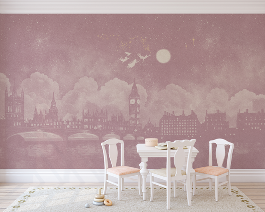 Watercolour pink London skyline at night inspired by Peter Pan mural in  children's playroom with a white colouring in table and chairs