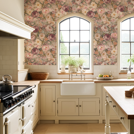 Kitchen with floral wallpaper, white sink, and wooden countertops.
