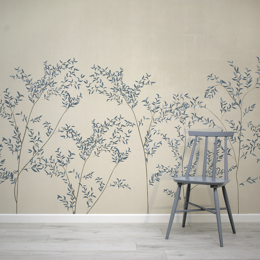 Wall with decorative leaf pattern and a wooden chair in front