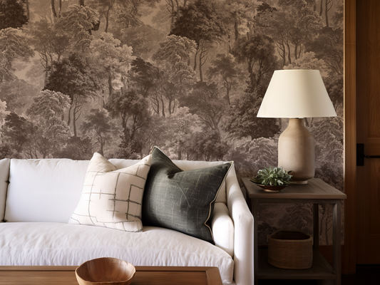 Living room with a forest wallpaper, white sofa, and wooden side table.