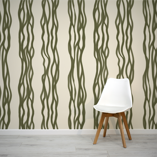 White chair against a wall with wavy green pattern