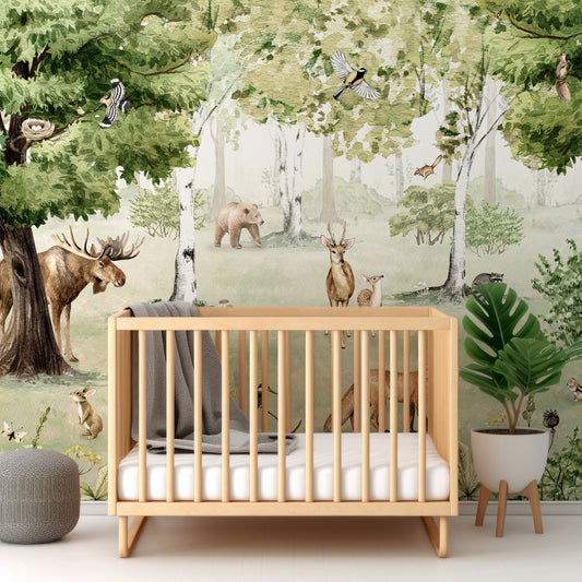 Woodland Wonders Wallpaper In Nursery With Wooden Crib And Green Plant And Grey Blankets
