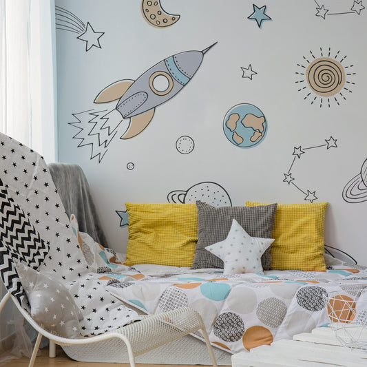 Wrigure in Kid's Room with spotty duvet and yellow cushions