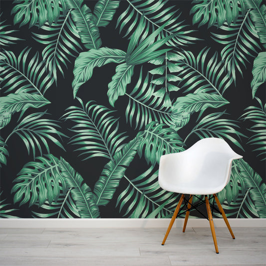Black and green dark tropical leaf wall mural by WallpaperMural.com