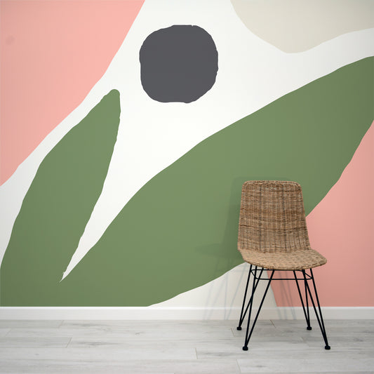 Abstract shapes reminiscent of a flower and leaf, all set in dark green and peach. What a beautiful wallpaper mural!