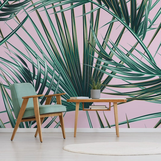 Pink Palm wallpaper mural with. Green chair and a table | WallpaperMural.com